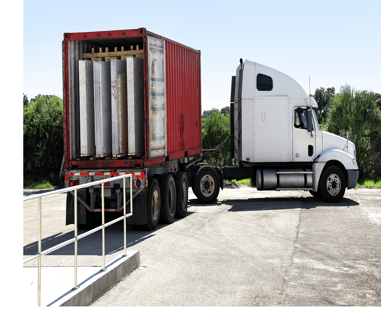 Semi-truck parked near loading dock