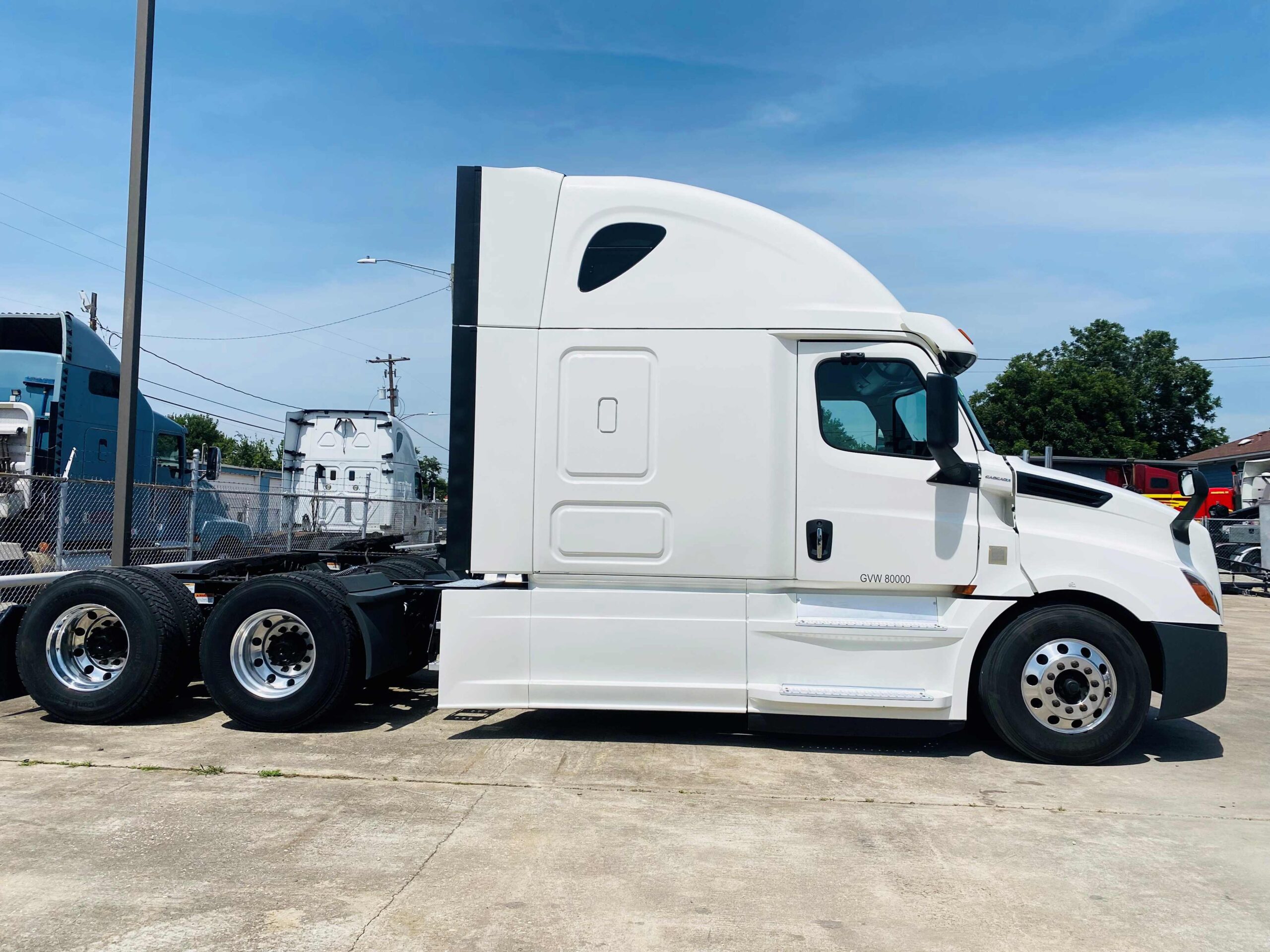 White tractor unit on concrete pavement