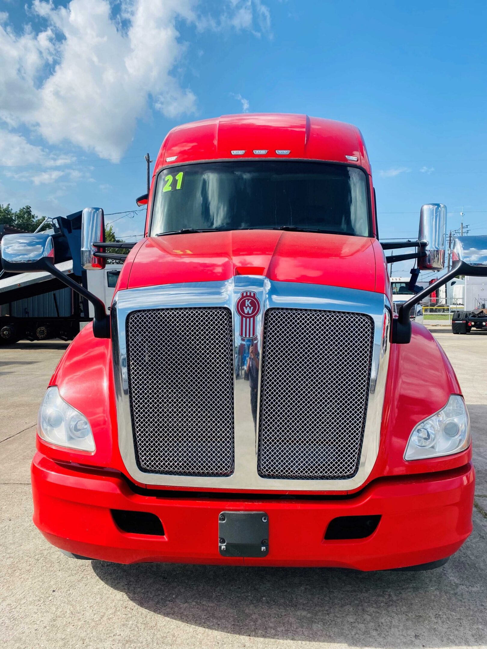 Bright red truck under blue sky