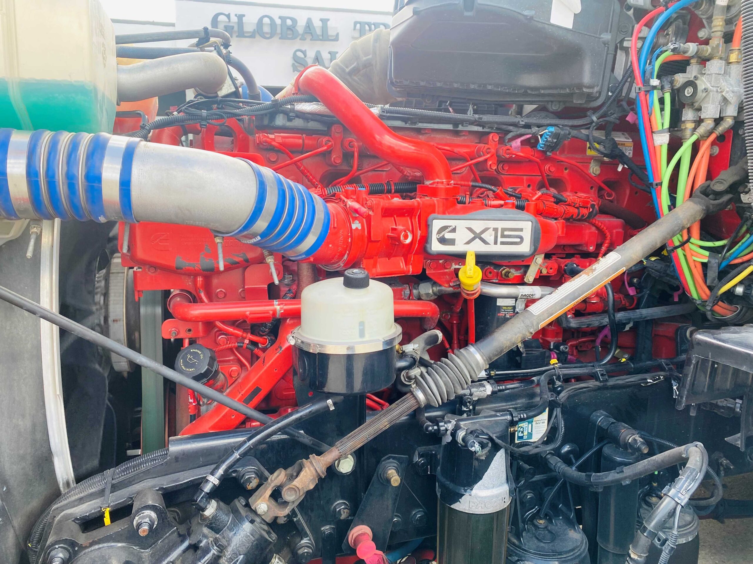 Red diesel engine with blue hoses
