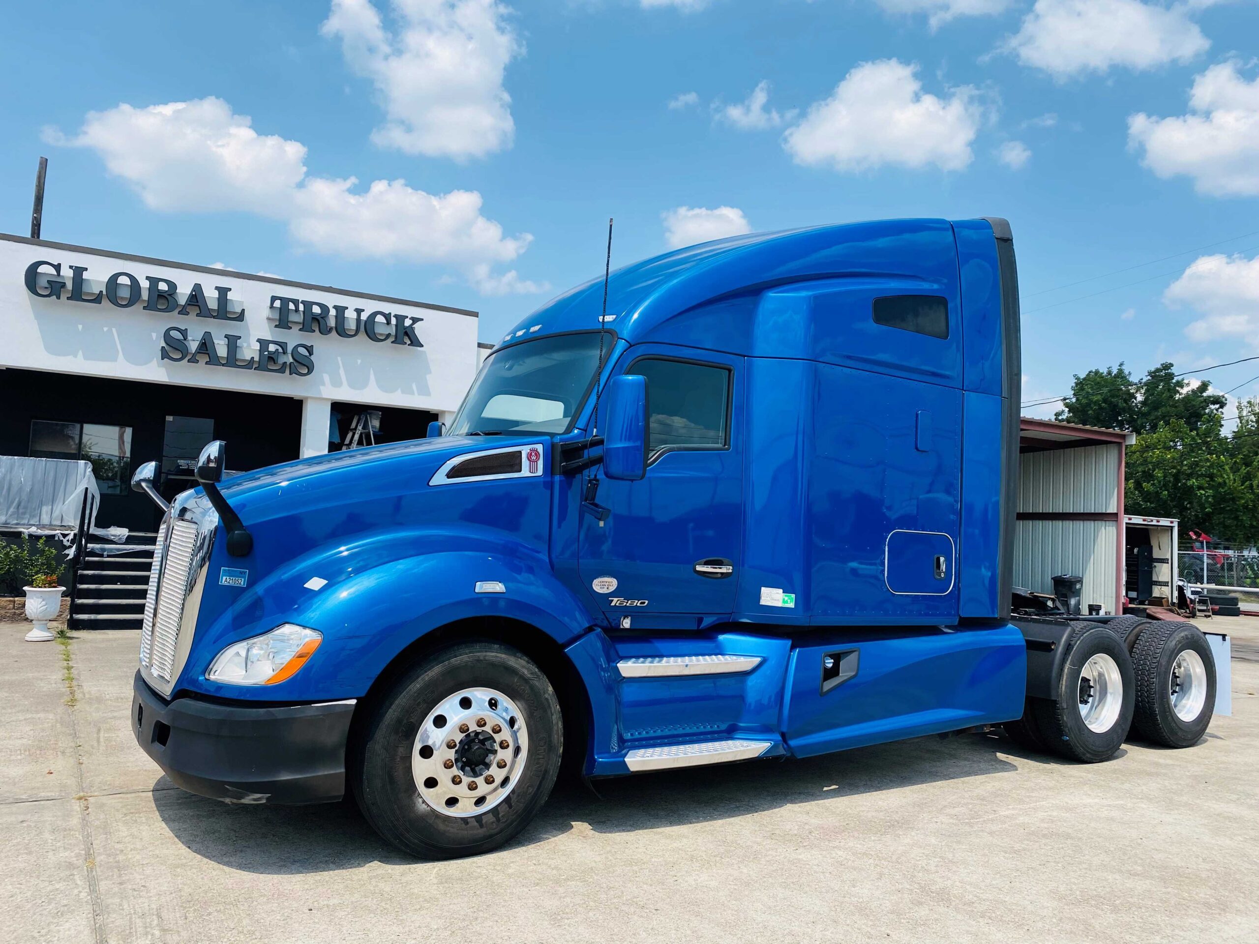 Large blue truck parked in front