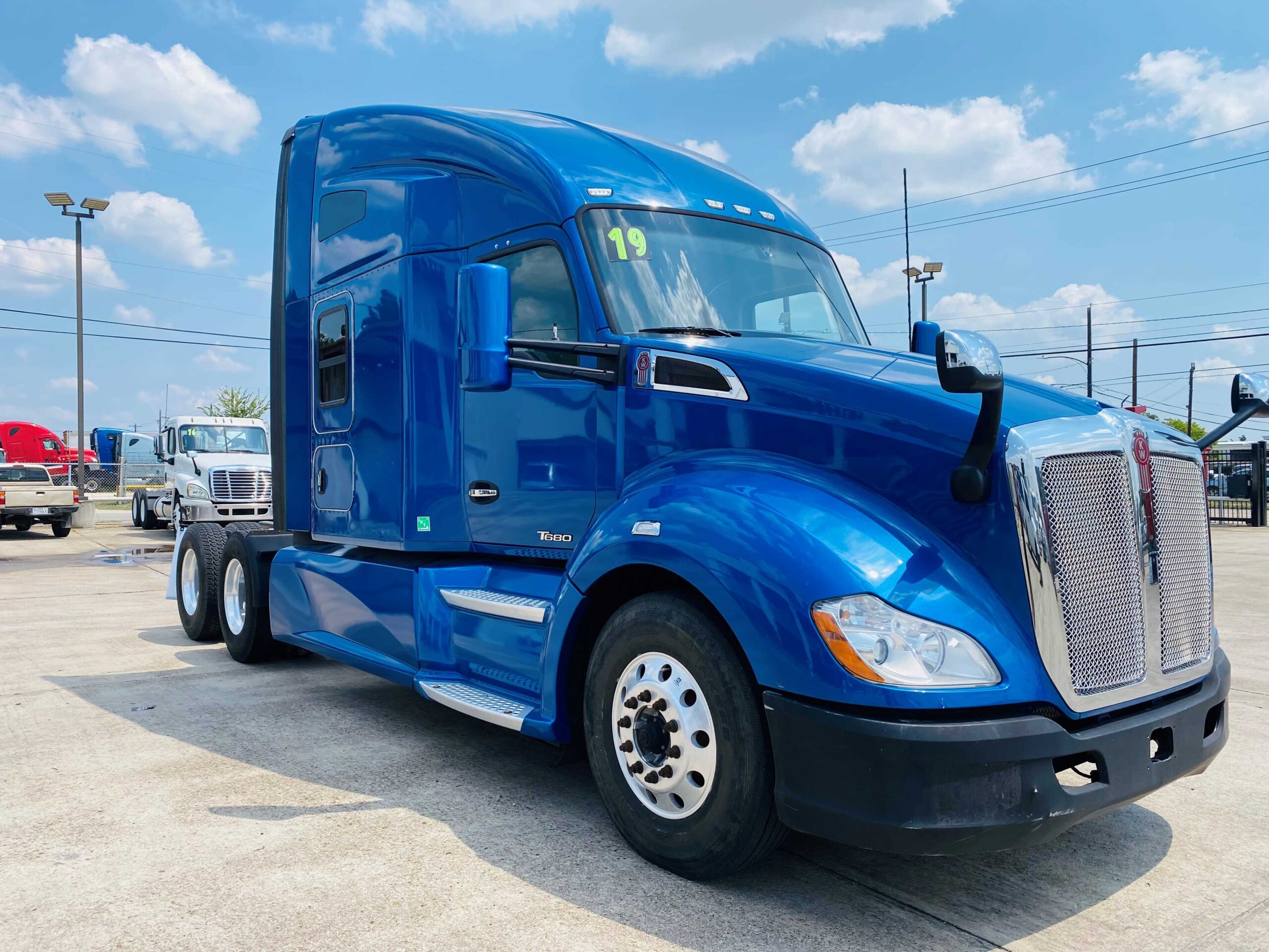 Large blue semi-truck under sky