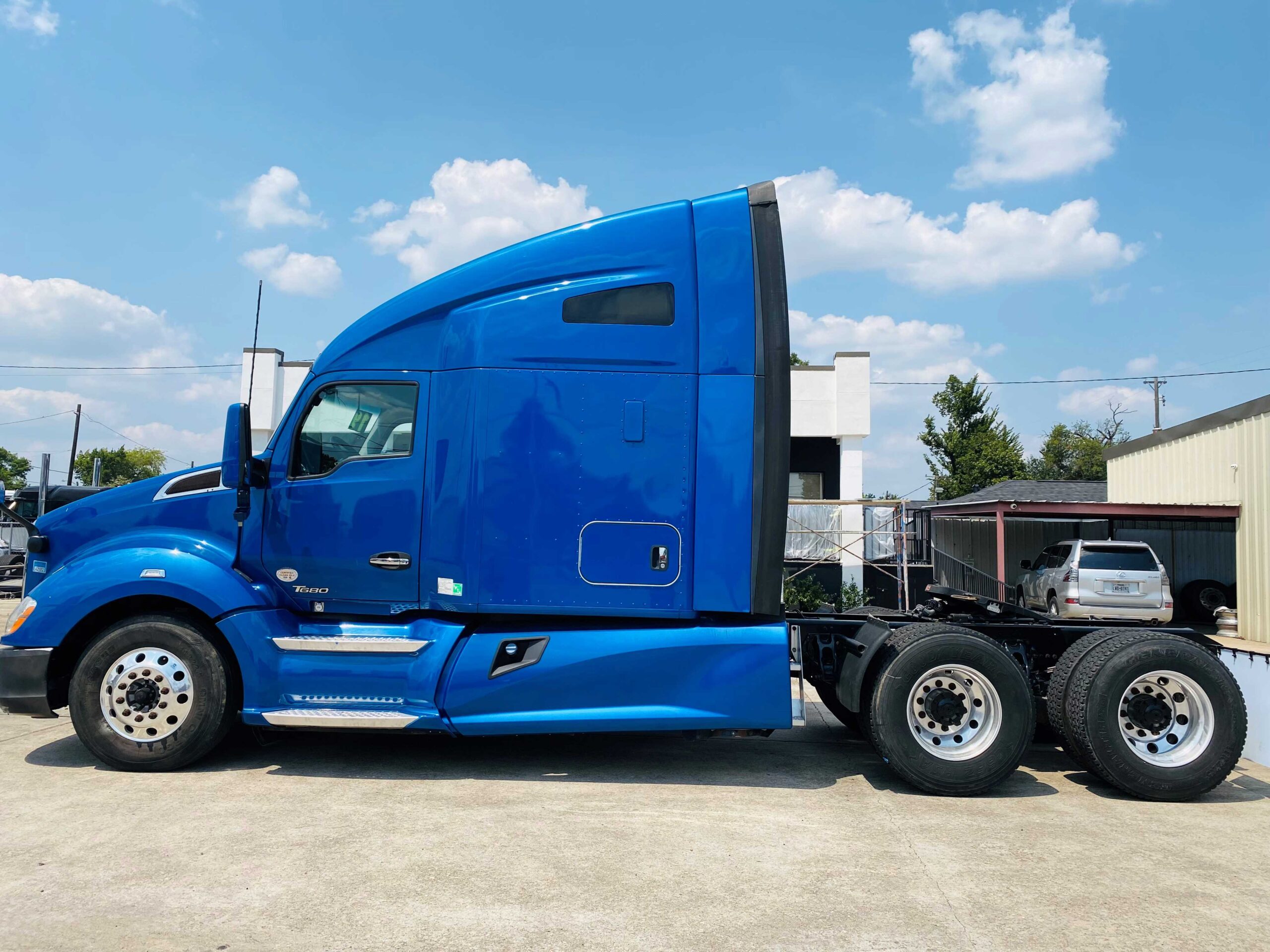 Blue semi-truck parked outdoors