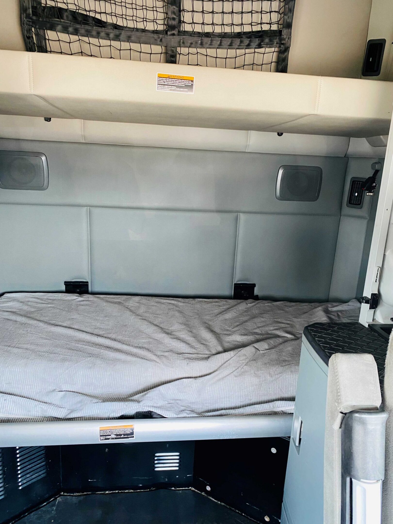 Cozy bunk bed in truck cabin