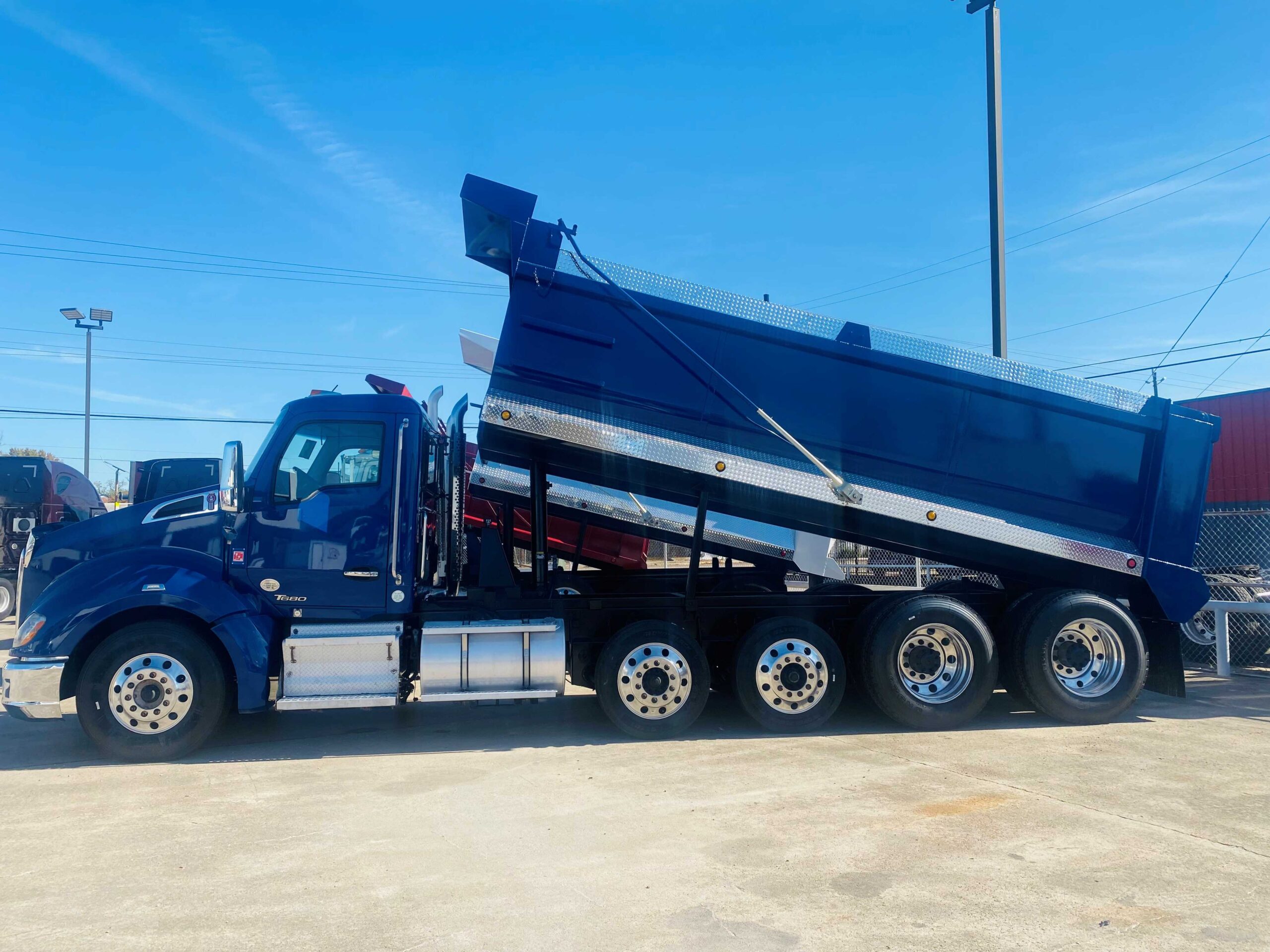 Large blue dump truck outdoors