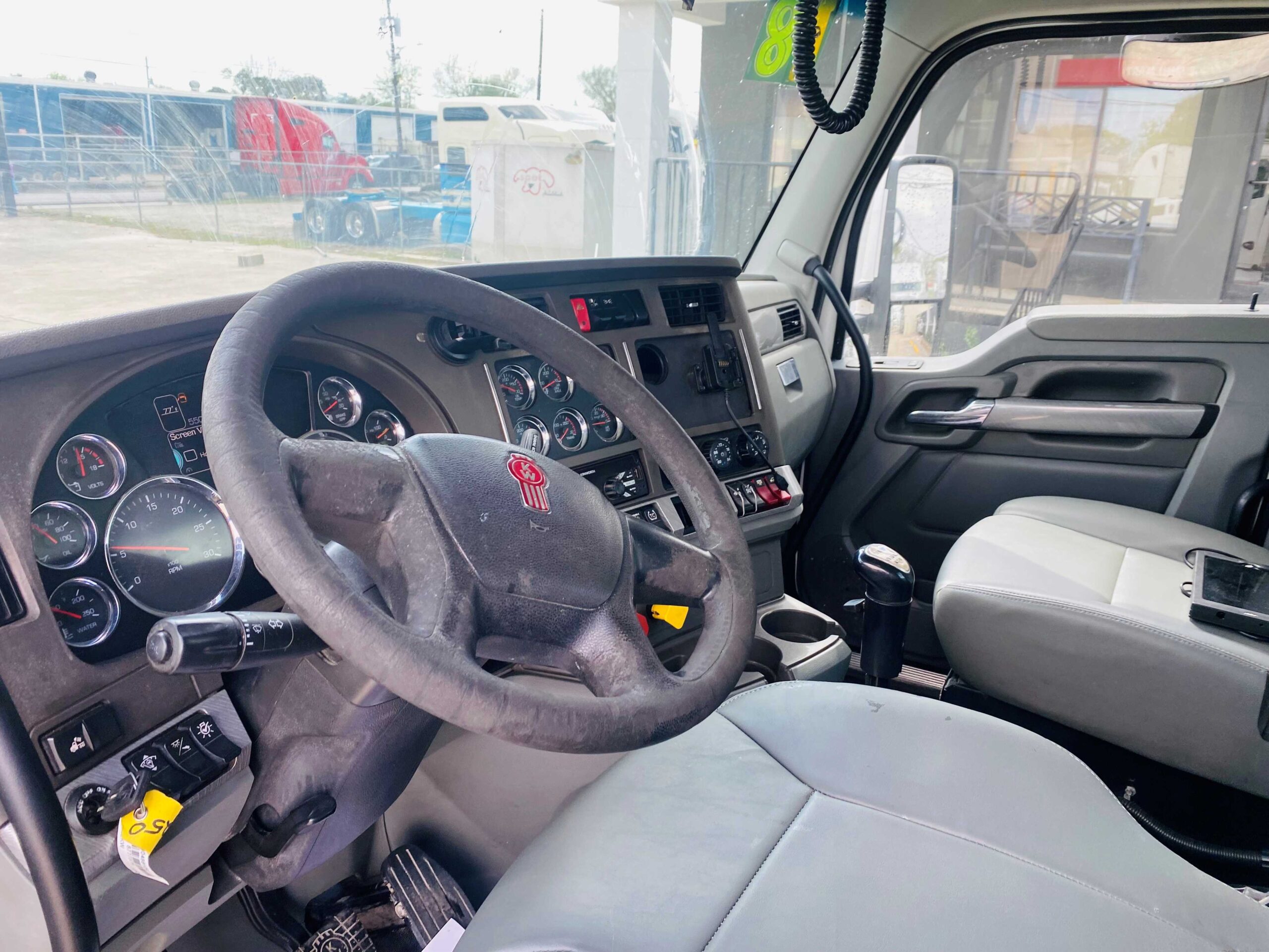 Truck cabin interior with steering wheel