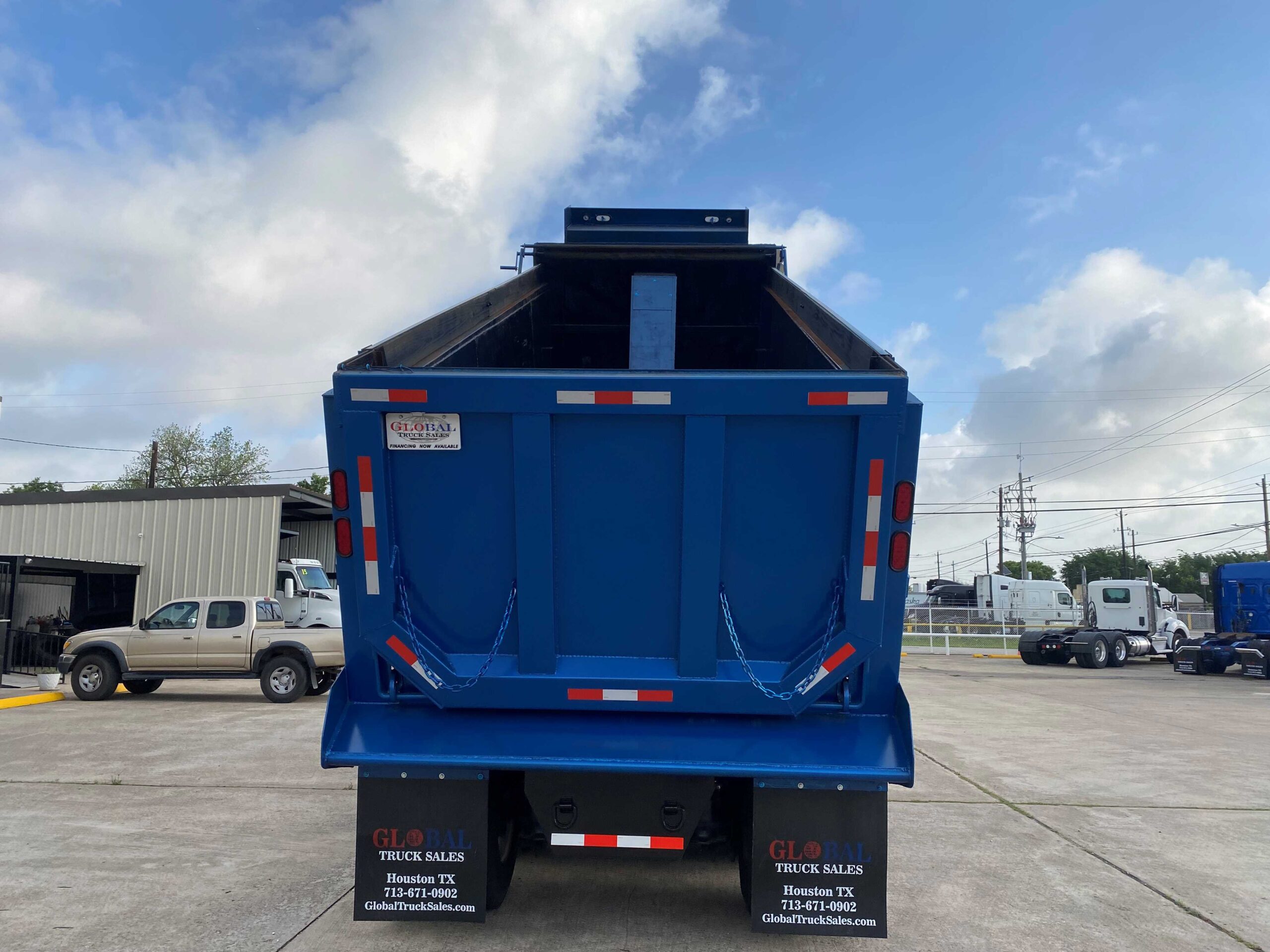 Blue dump truck rear view