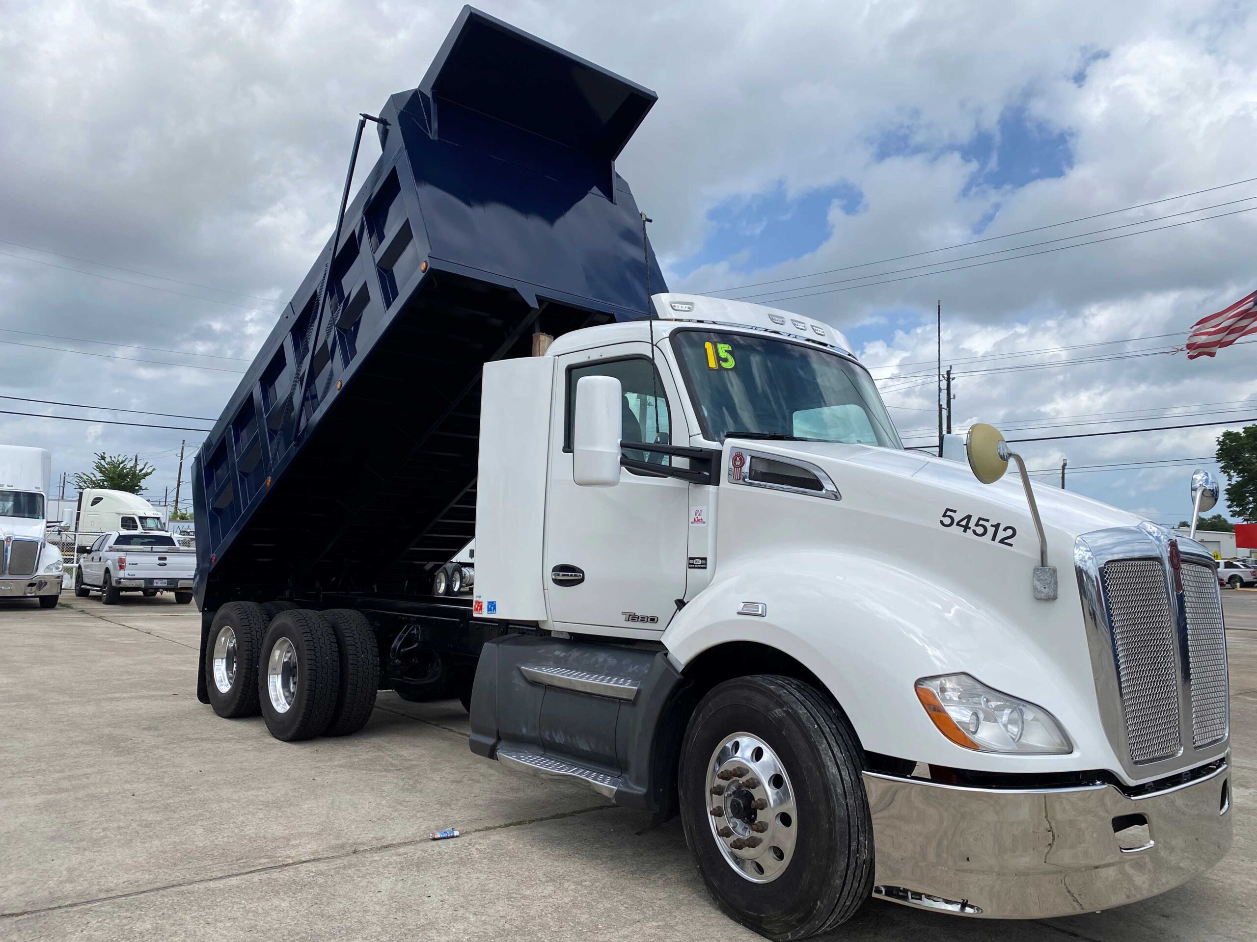 White dump truck with raised bed