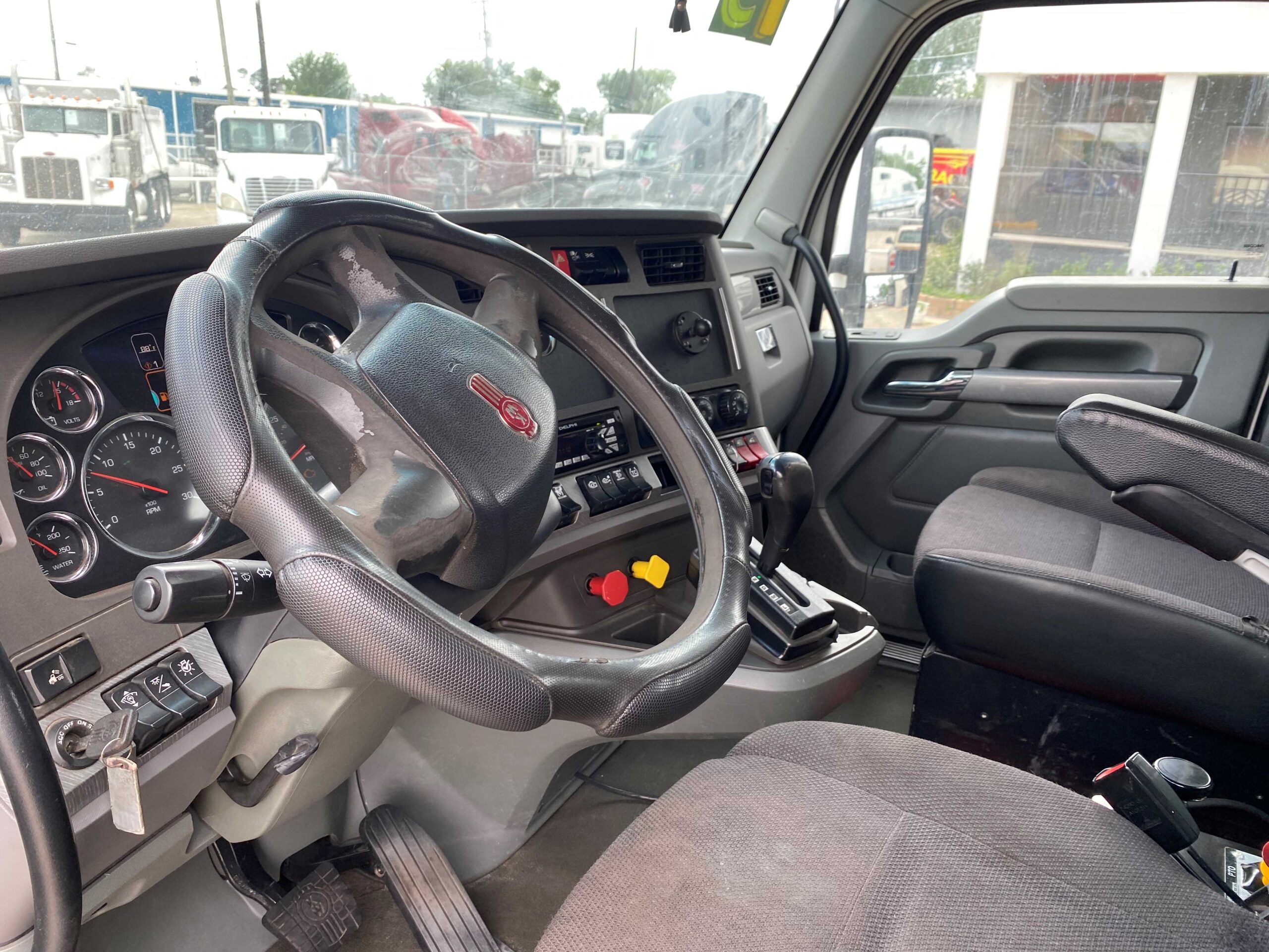 Truck cabin interior with steering wheel