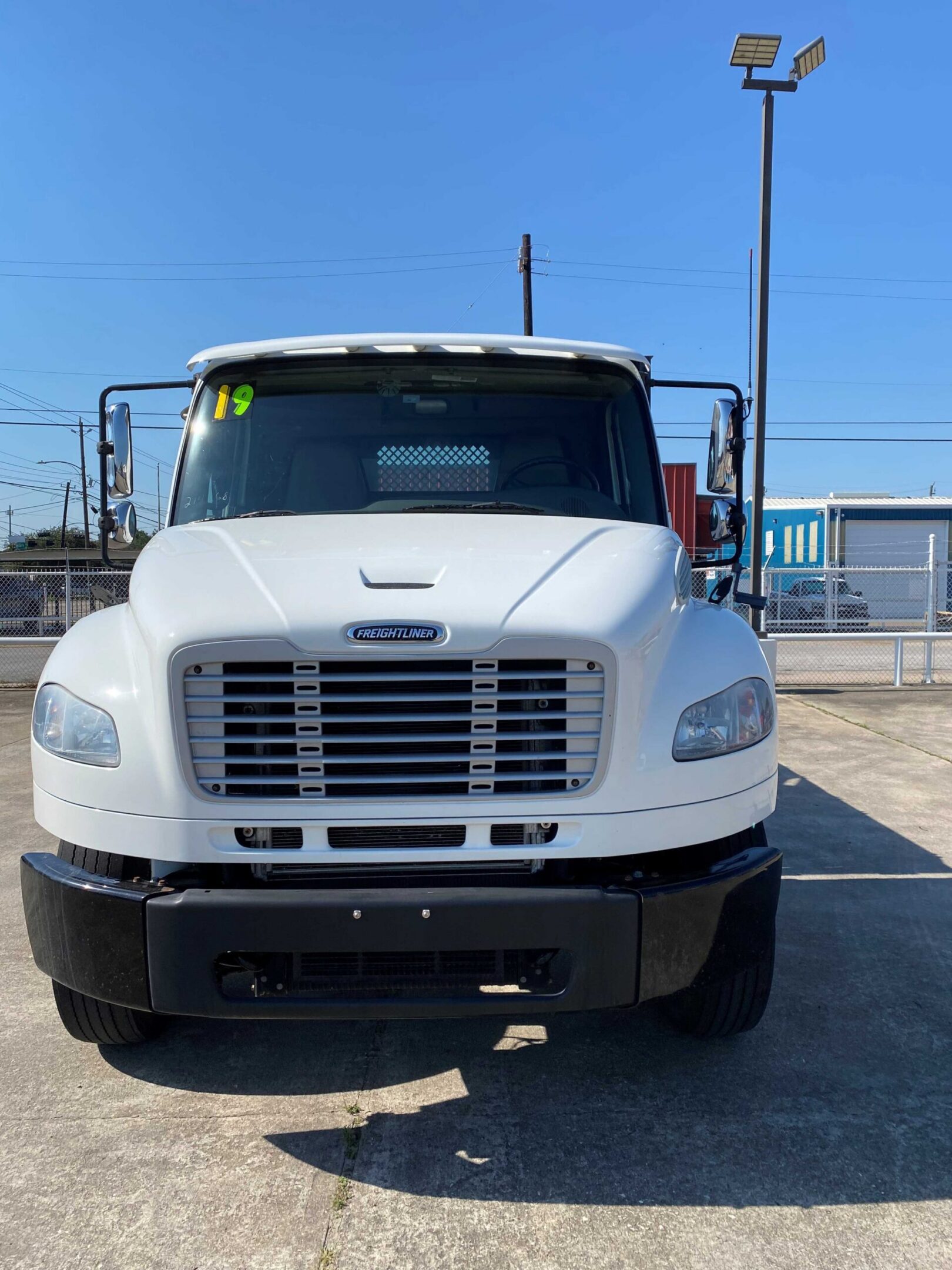 Large white truck under clear sky