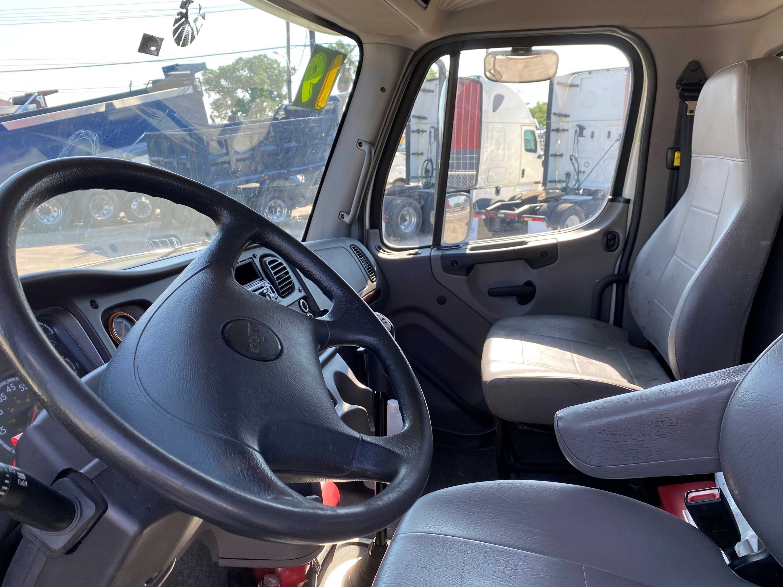 Driver's seat inside a truck cabin