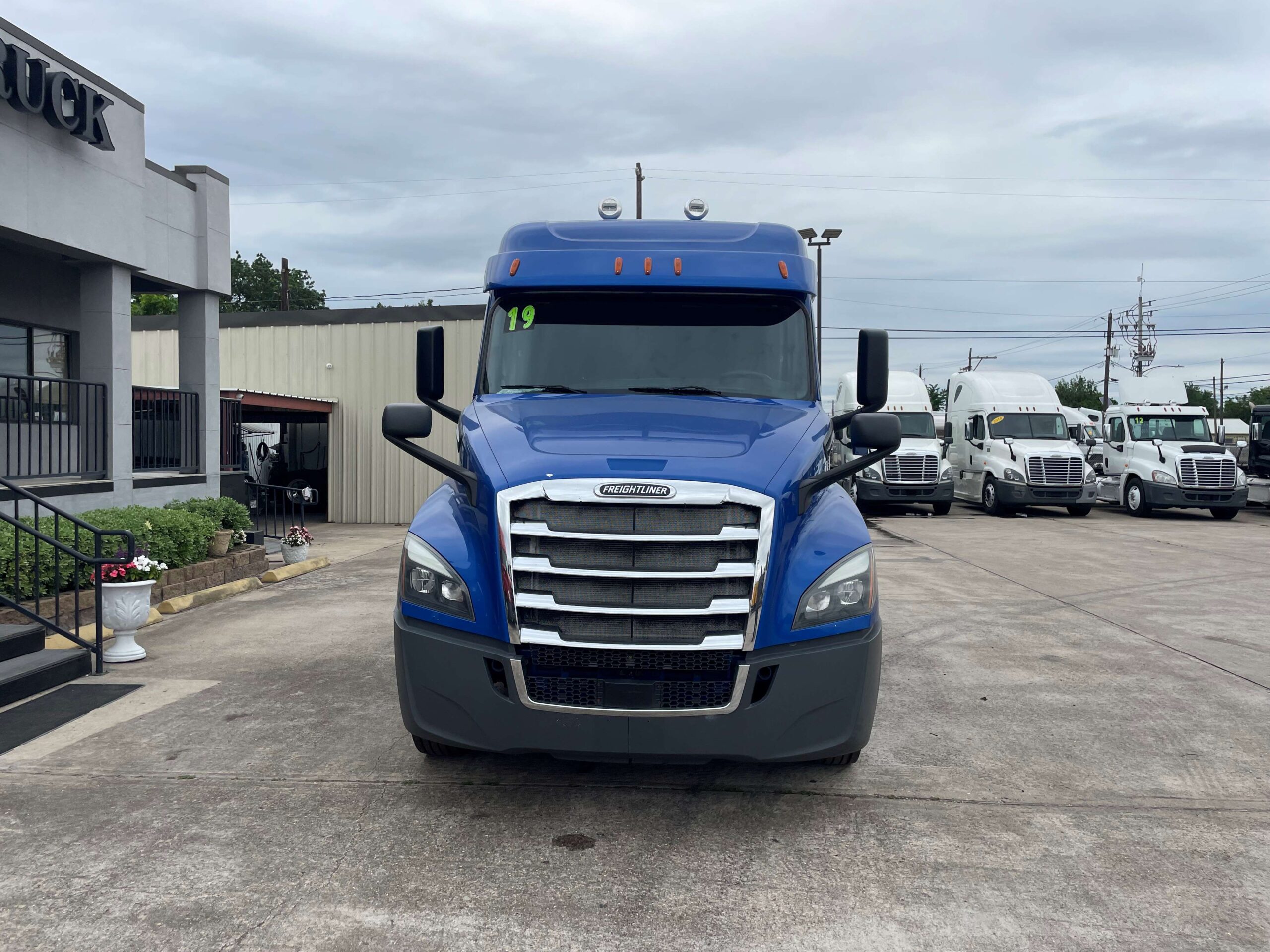 Blue truck in parking lot display