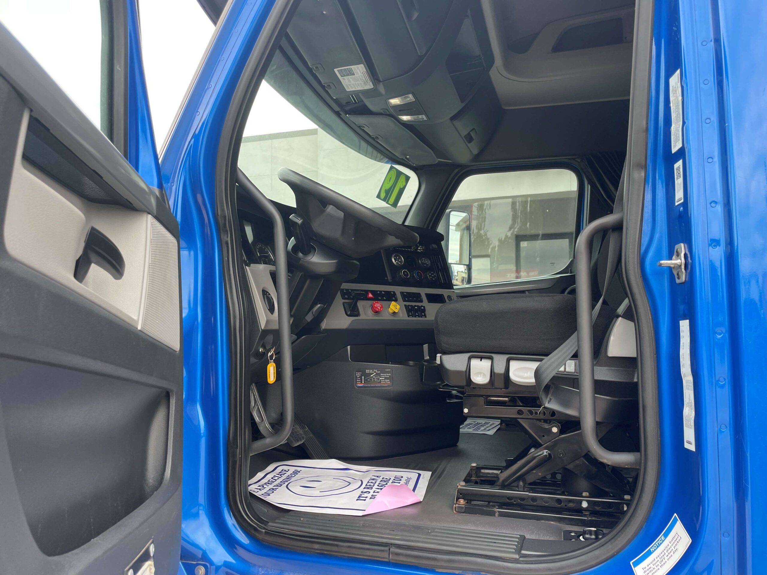Truck cab interior with open door