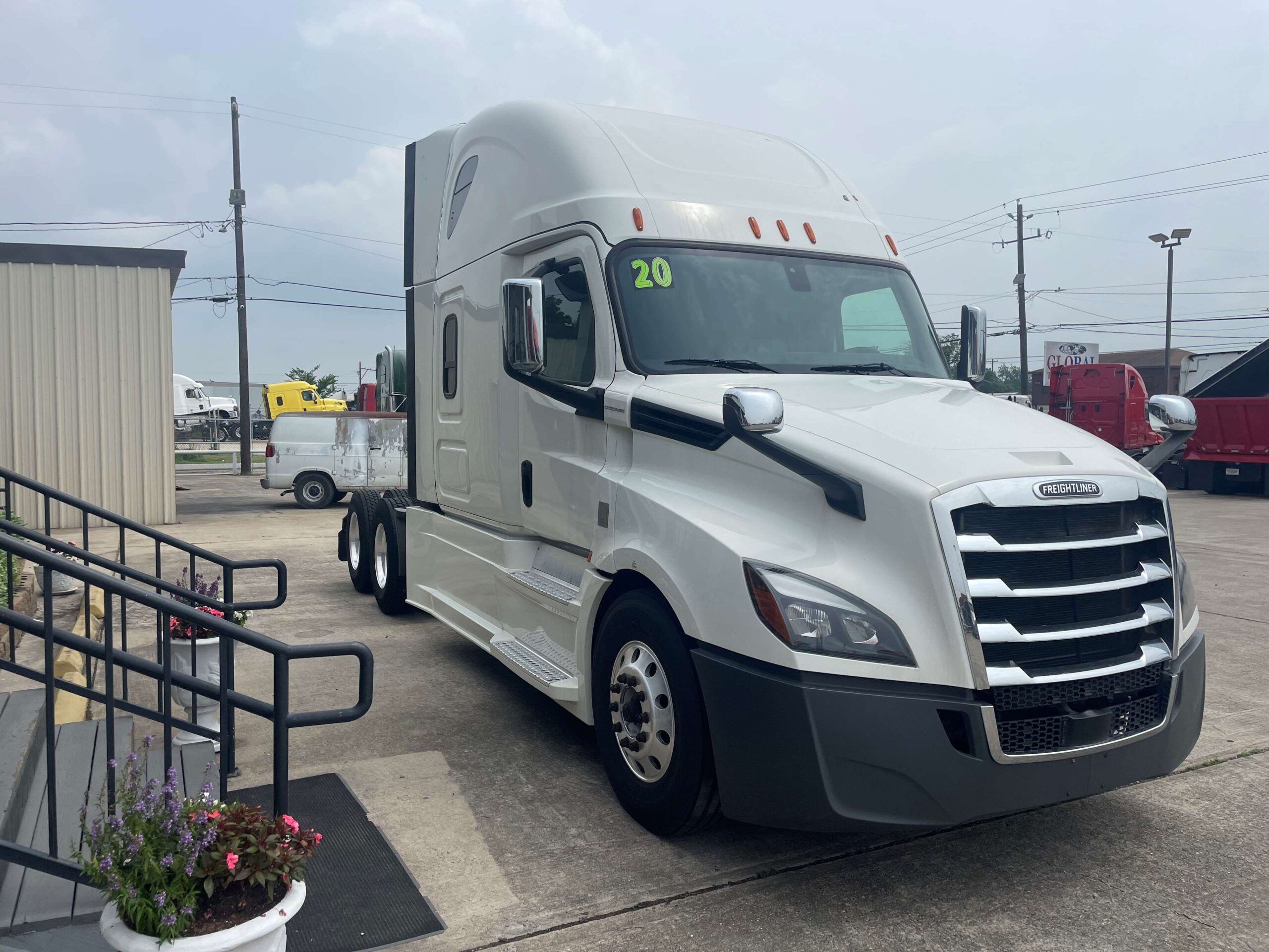 Modern tractor-trailer near a building