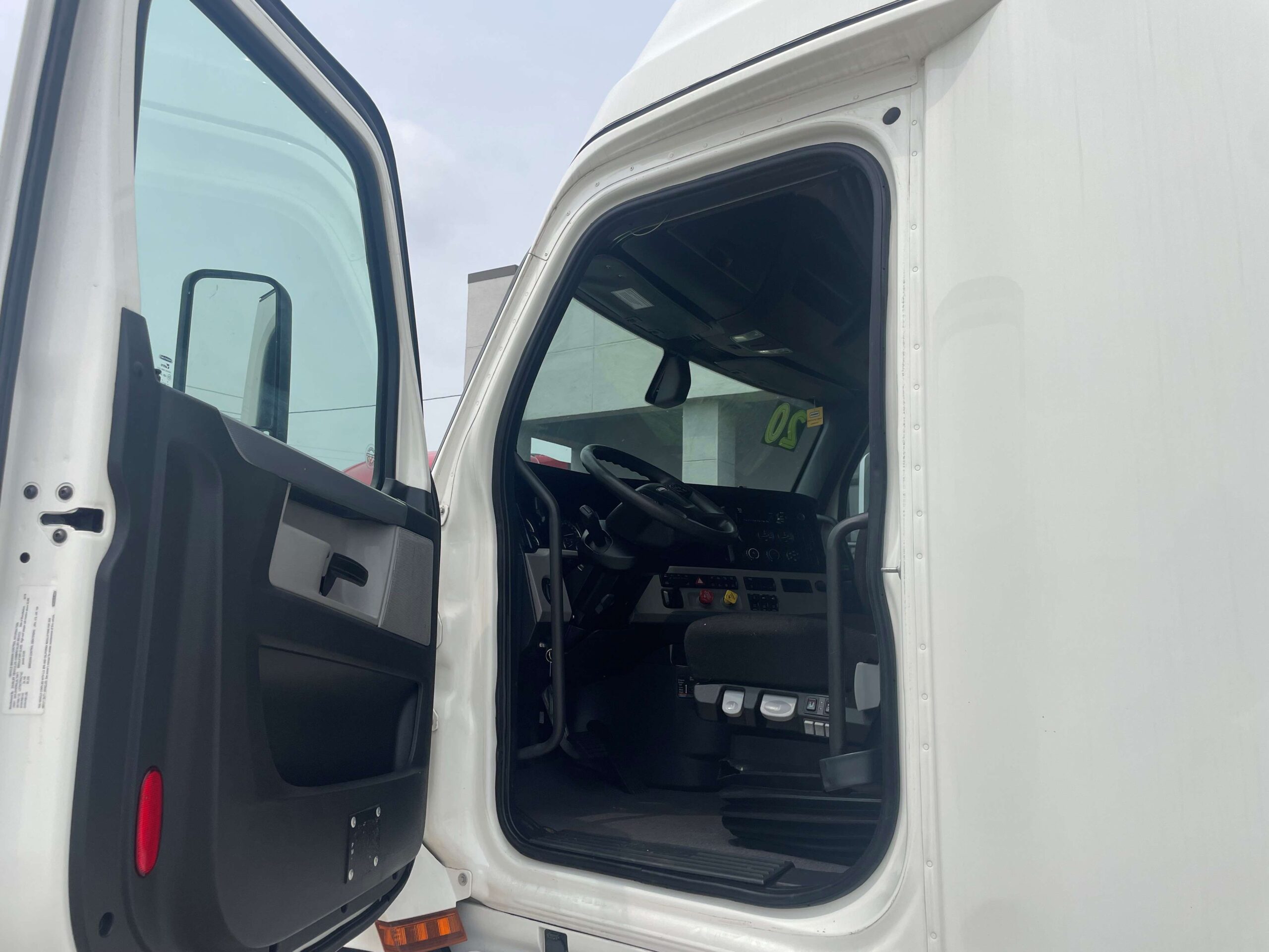 Truck cab interior with open door